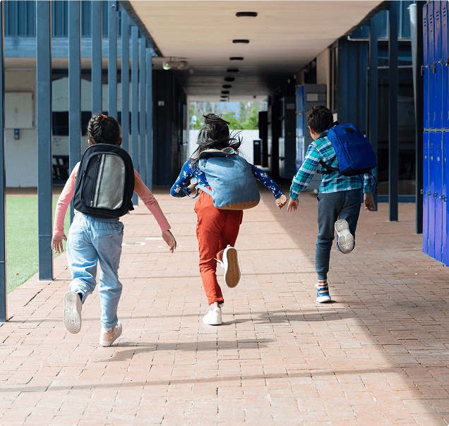 Students walking in school hallway